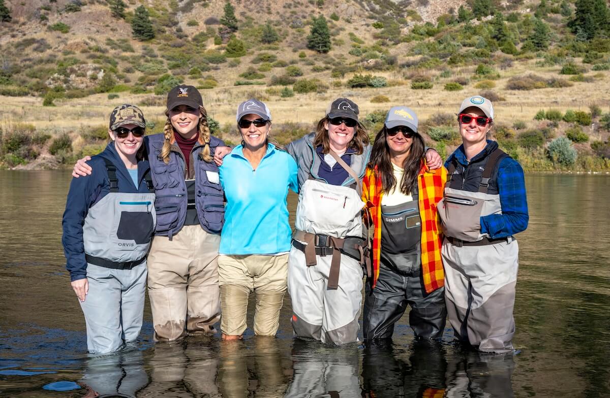 People standing in a stream