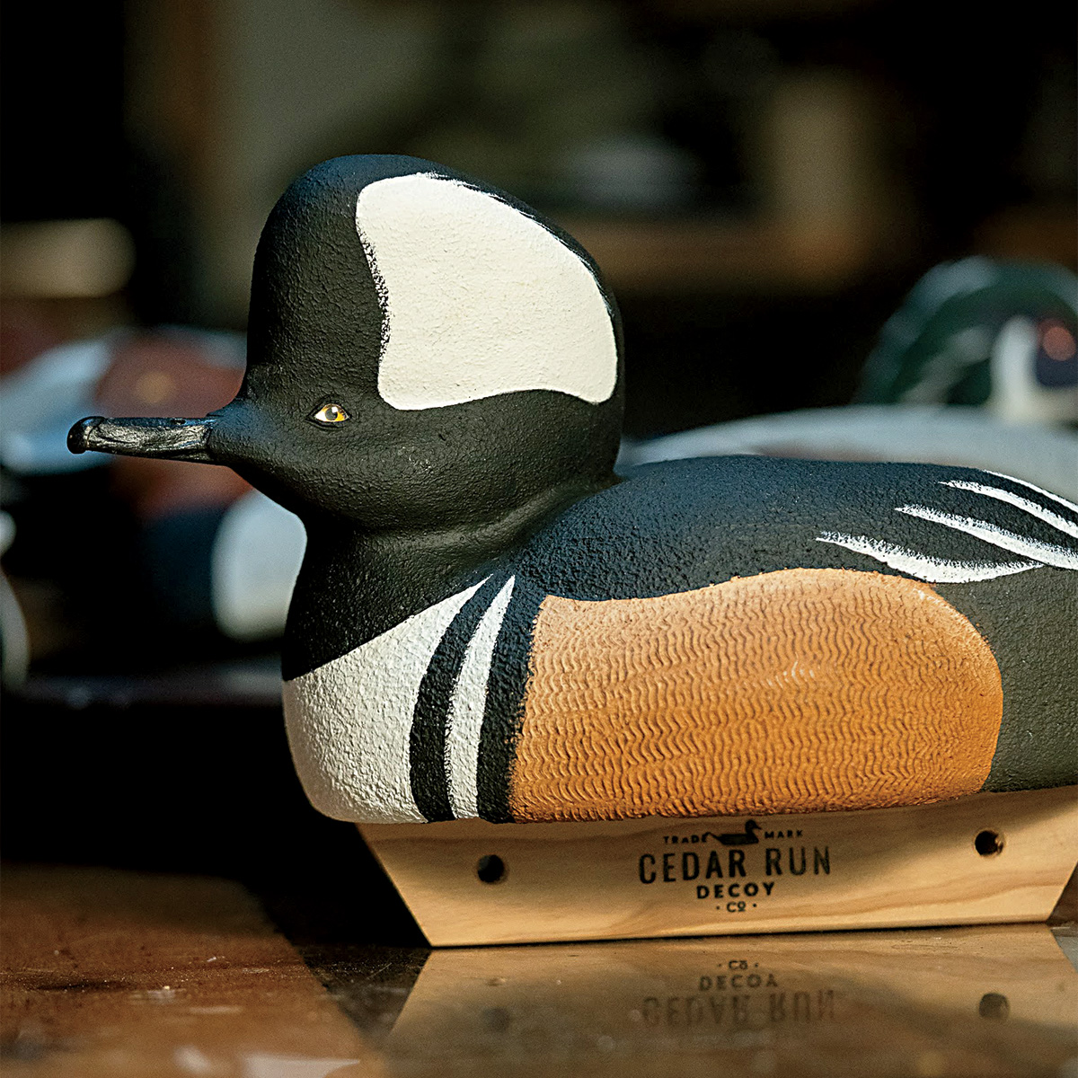 Carved hooded merganser decoy. Photo by cedarrundecoys.com