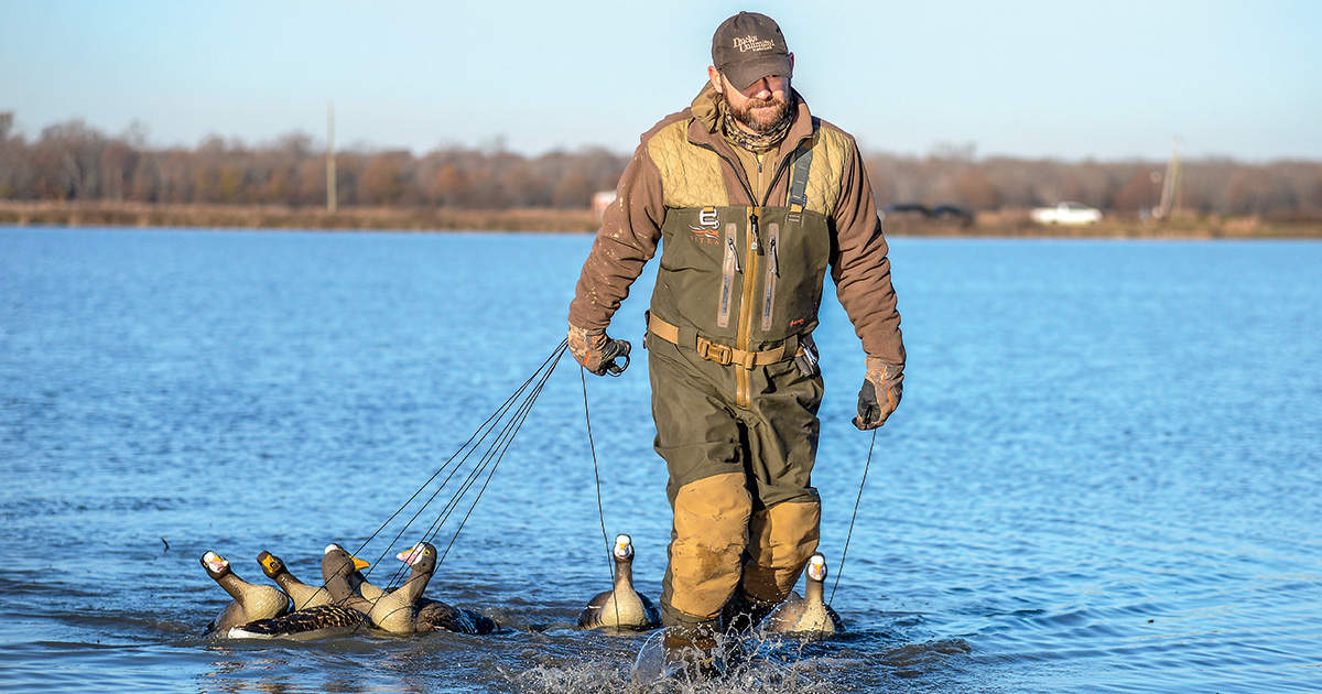 Hunter dragging decoys out. Photo by John Hoffman, Ducks Unlimited