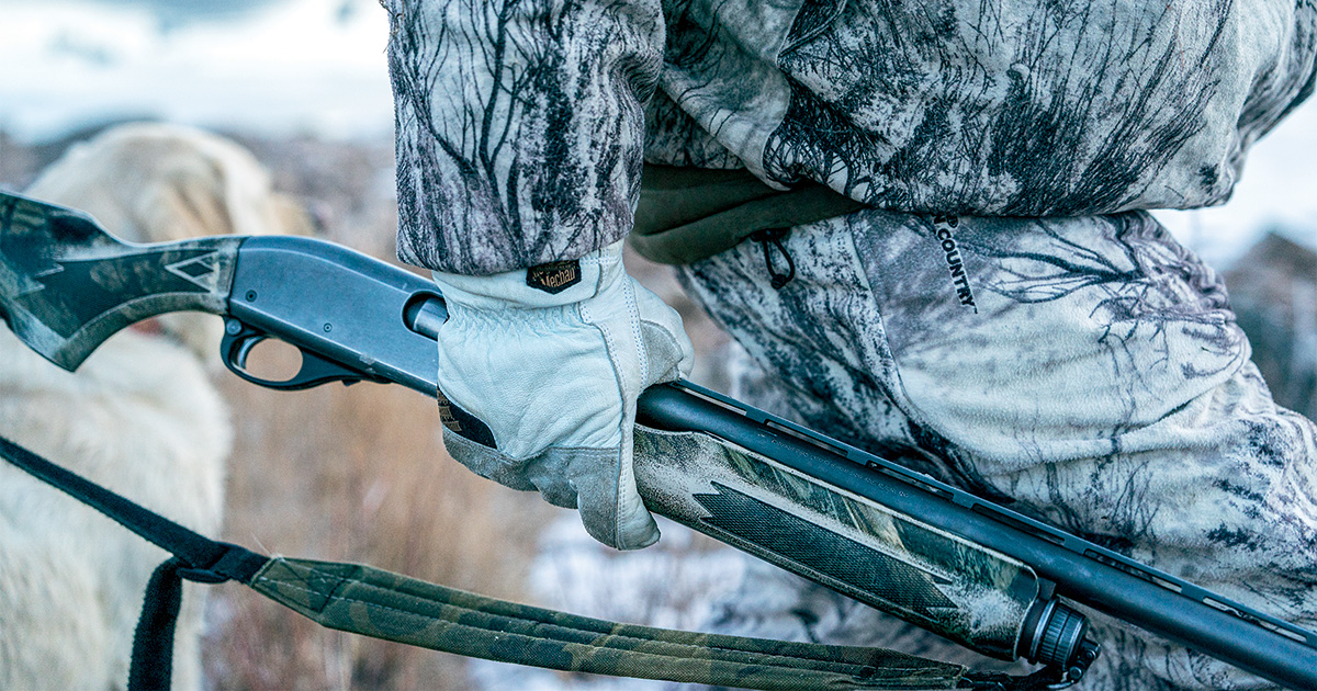 Hunter and shotgun. Photo by Greg Sweeney
