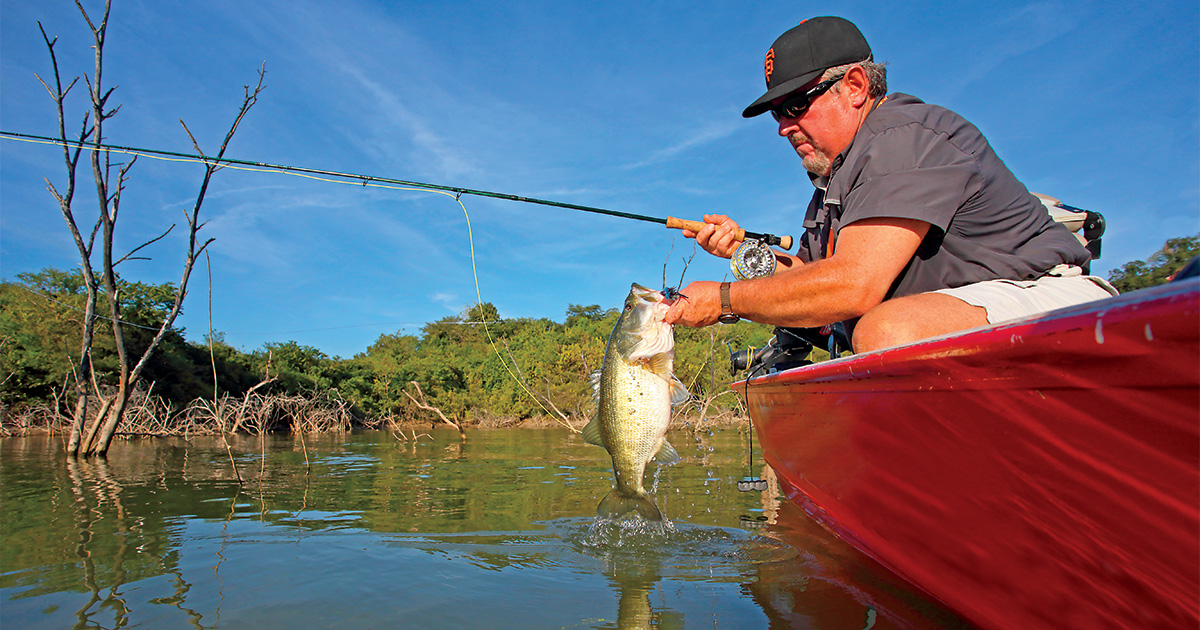 Angler and largemouth bass. Photo by GaryKramer.net