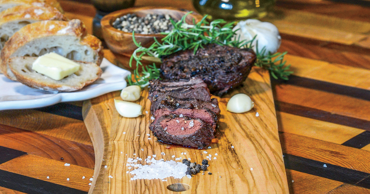 Grilled duck breast being served. Photo by John Hoffman, DU